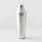 25oz brushed stainless steel cocktail shaker with integrated measuring cap and vacuum-insulated double-wall design.