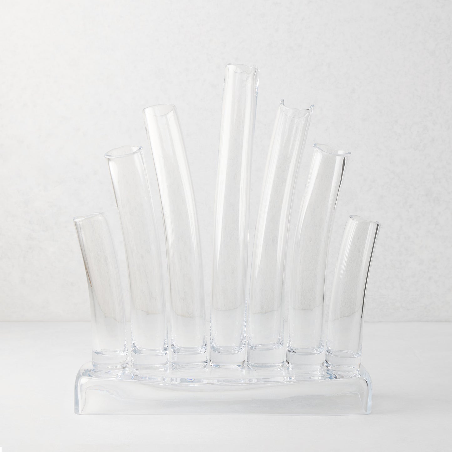 Large Elli clear scissor-cut glass vase with multiple stair-step tubes on a rectangular base.