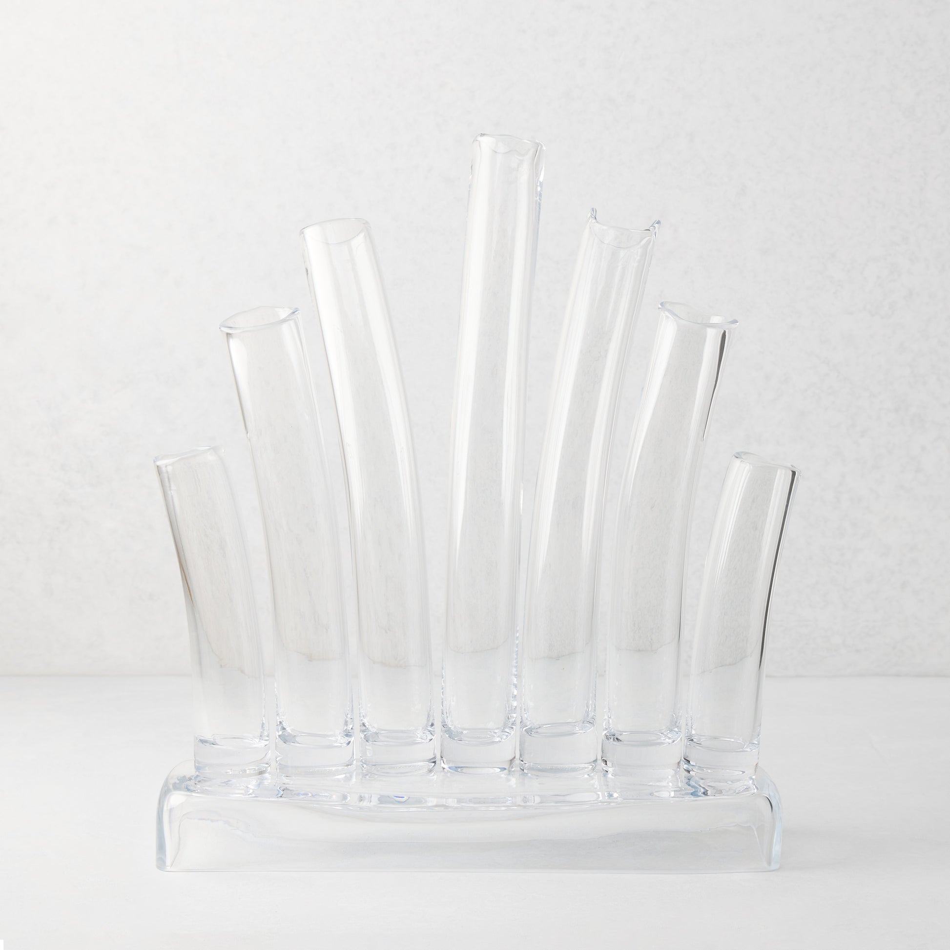 Large Elli clear scissor-cut glass vase with multiple stair-step tubes on a rectangular base.