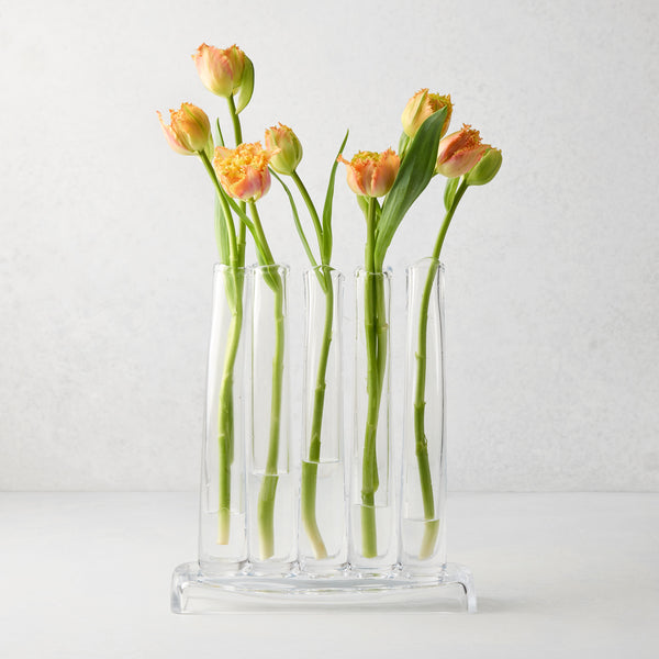 Elli Small Scissor-Cut Glass Vase, clear, rectangular base with five individual tubes holding orange tulips.