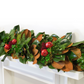 Fresh 6' holiday garland with green magnolia leaves, spruce, and red pomegranates.
