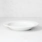 Everyday Porcelain Bowl, a classic white soup bowl with a wide rim.