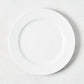 White porcelain salad plate with a classic rim from the Everyday Collection.