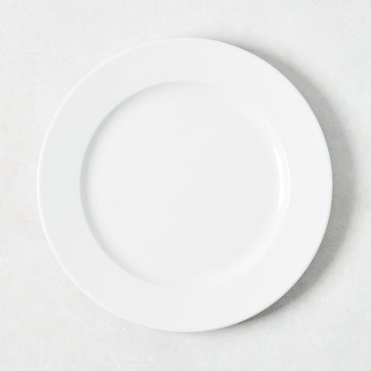 White porcelain salad plate with a classic rim from the Everyday Collection.