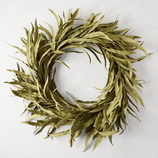 12" faux willow wreath with long, narrow green plastic leaves, creating a full, round shape.