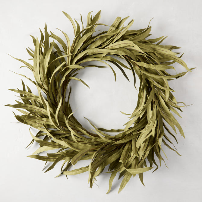 12" faux willow wreath with long, narrow green plastic leaves, creating a full, round shape.