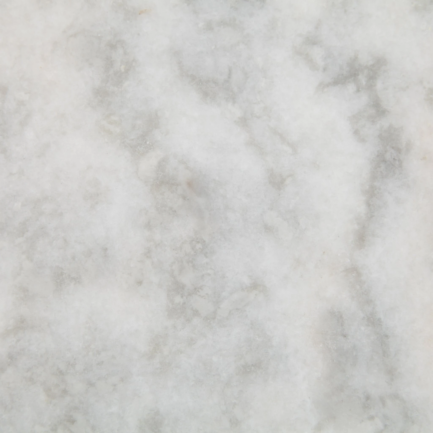 White marble with subtle grey veining, a close-up texture.