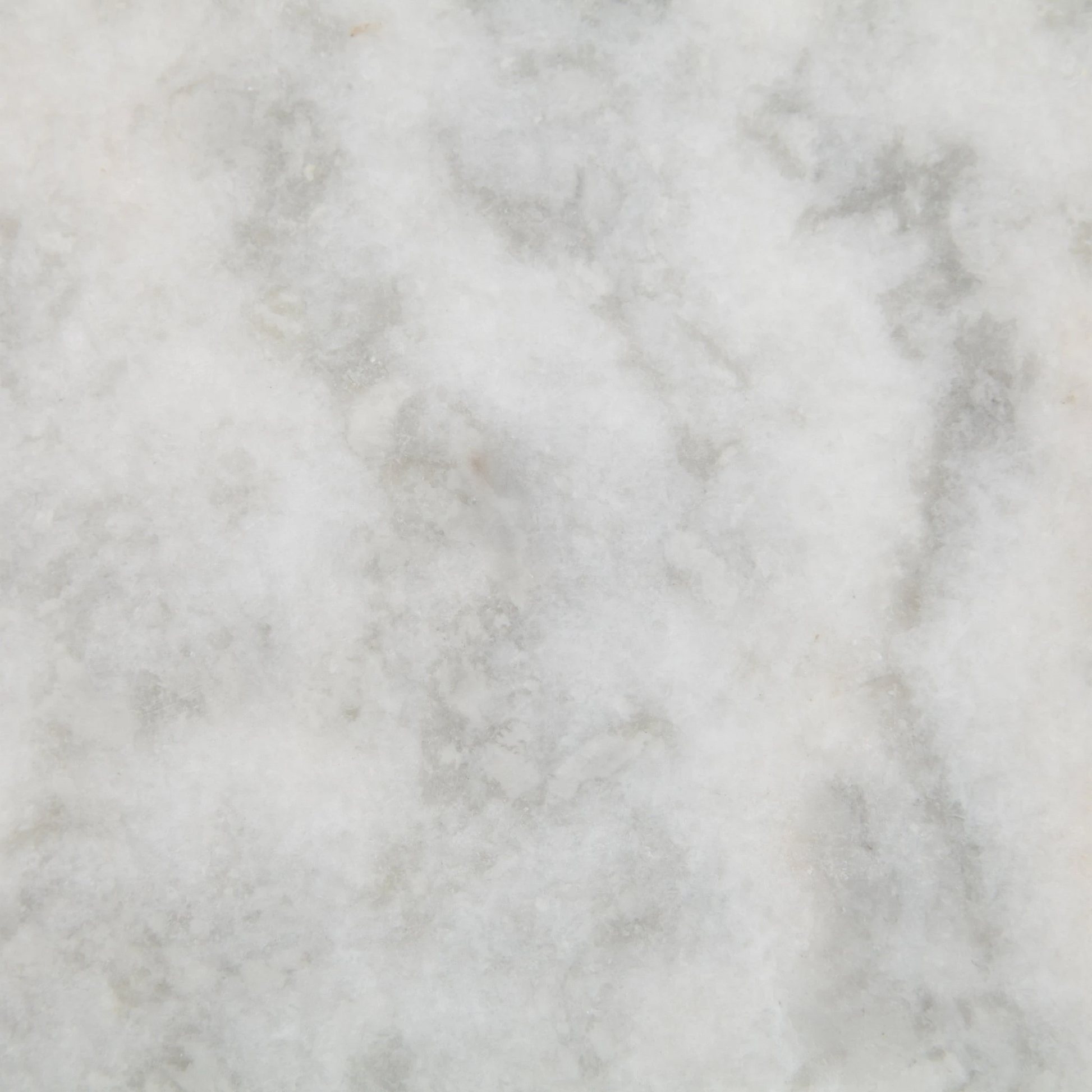 White marble with subtle grey veining, a close-up texture.