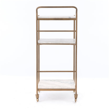 Felix antique brass bar cart with three white marble square shelves and casters.