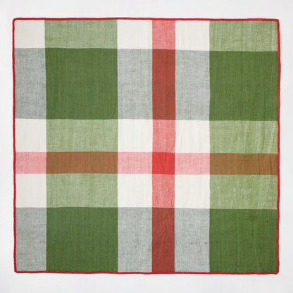 Festive green, red, and white plaid cotton napkin with embroidered red trim, 22" square.