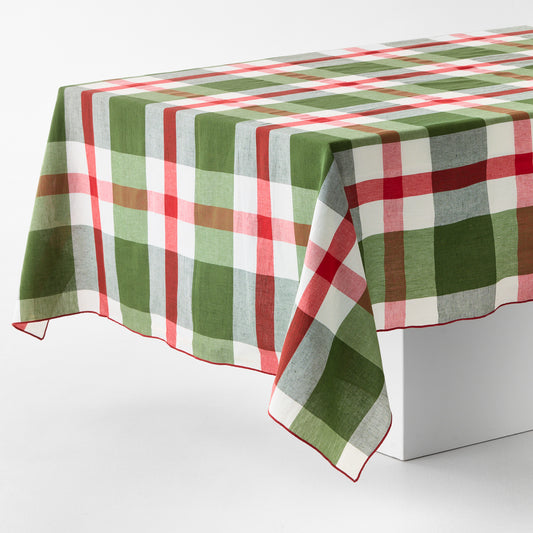 108x70-inch cotton tablecloth with a festive red and green plaid pattern and embroidered red trim edge.