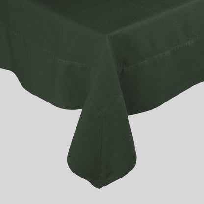 Fir HG hand-dyed dark green linen tablecloth with mitered corner detailing.