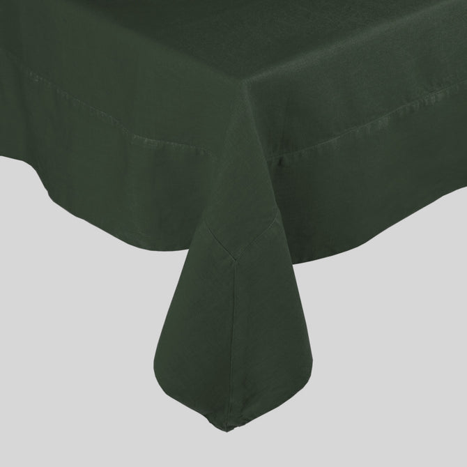 Fir HG hand-dyed dark green linen tablecloth with mitered corner detailing.