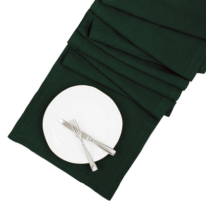 Fir HG hand-dyed dark green linen table runner, 18"x108", with white plate and silverware.
