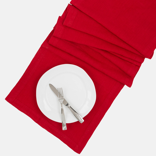 Flame HG Signature hand-dyed red linen table runner with white plate and silverware.