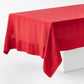 Flame red hand-dyed 100% linen tablecloth with a wide border and mitered corner detailing on a white table.