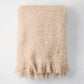 Folded Flax Beige Mohair Throw Blanket, 72"L x 51"W, with fringed edges.