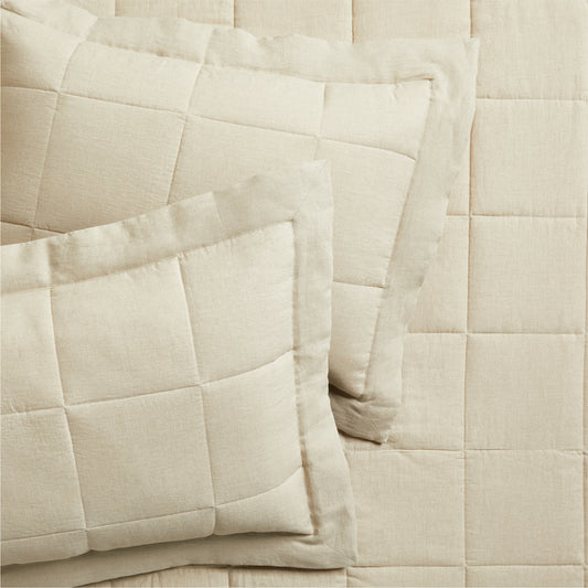 Set of 2 flax linen quilted shams in a natural beige color, with a subtle square pattern.