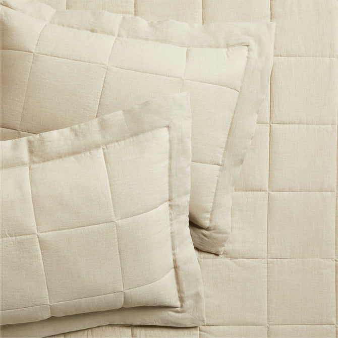 Set of 2 flax linen quilted shams in a natural beige color, with a subtle square pattern.