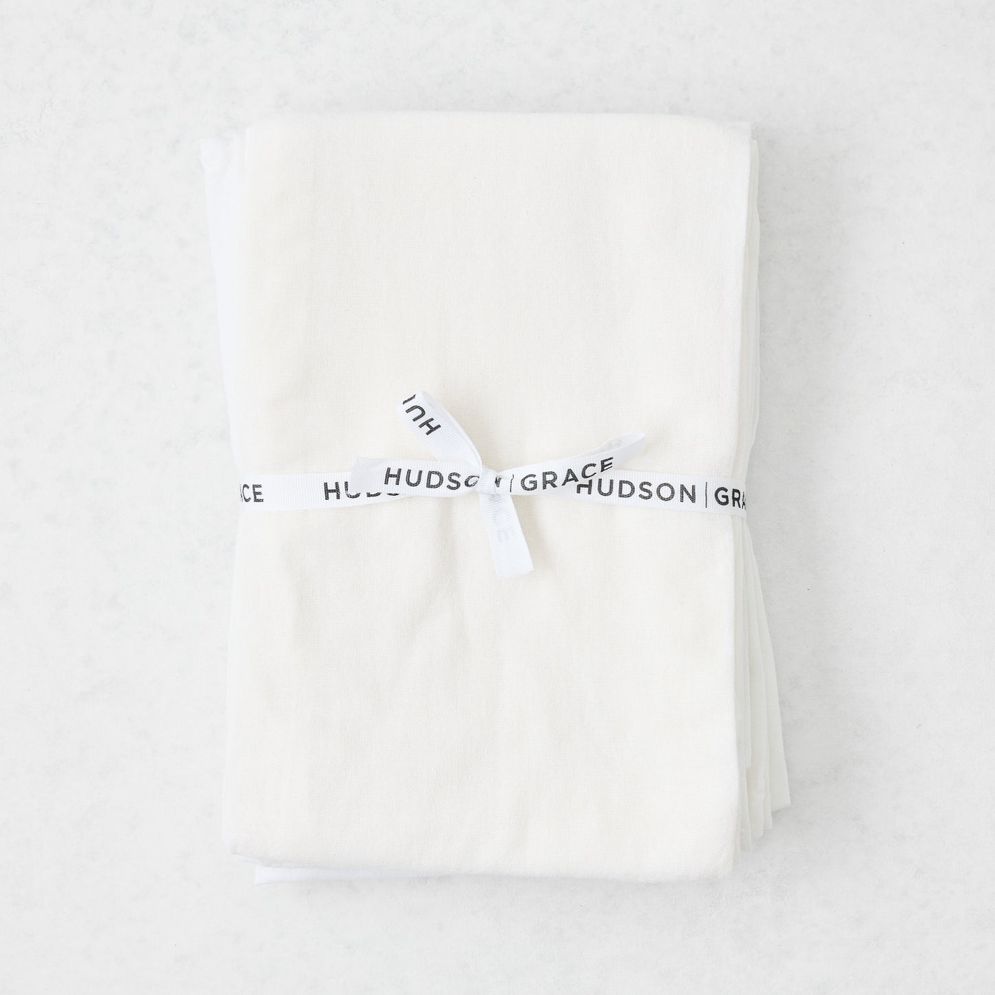 Stack of 6 white cotton flour sack towels, tied with a white "Hudson Grace" ribbon.