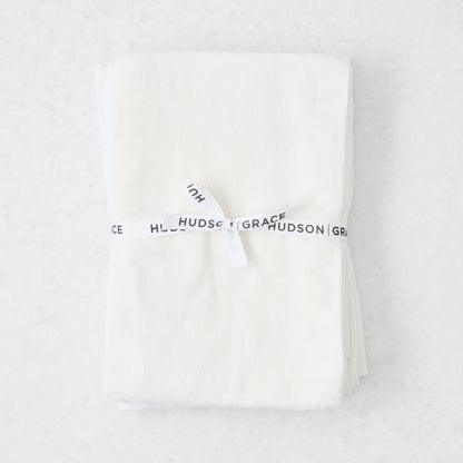 Stack of 6 white cotton flour sack towels, tied with a white "Hudson Grace" ribbon.
