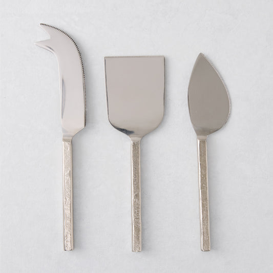 Forged silver 3-piece cheese knife set with hammered stainless steel handles.