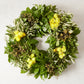 Fresh Spring Meadow Wreath with green olive, salal, yellow everlasting flowers, and gold phylica.