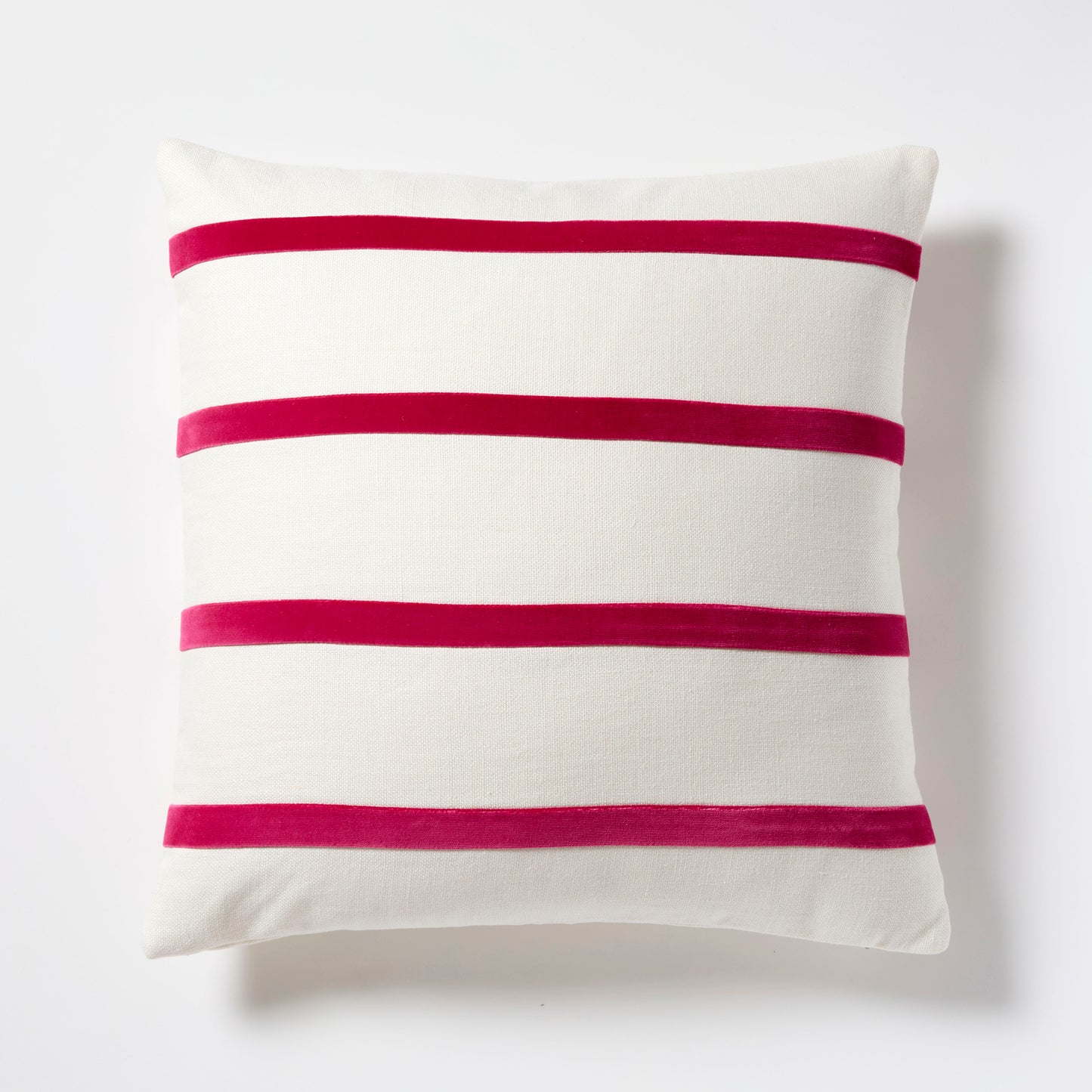 Fuchsia pink velvet stripes on an ivory linen square throw pillow.