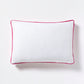 White linen lumbar pillow with fuchsia pink velvet gusset, 20"L x 14"H.
