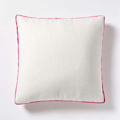 Square white linen pillow with fuchsia pink velvet gusset and piping.