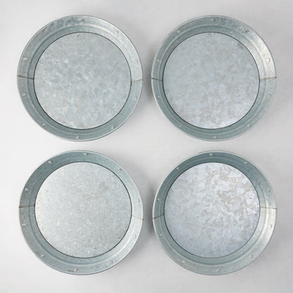 Set of 4 round galvanized metal plates with riveted edges, 12.75" diameter.
