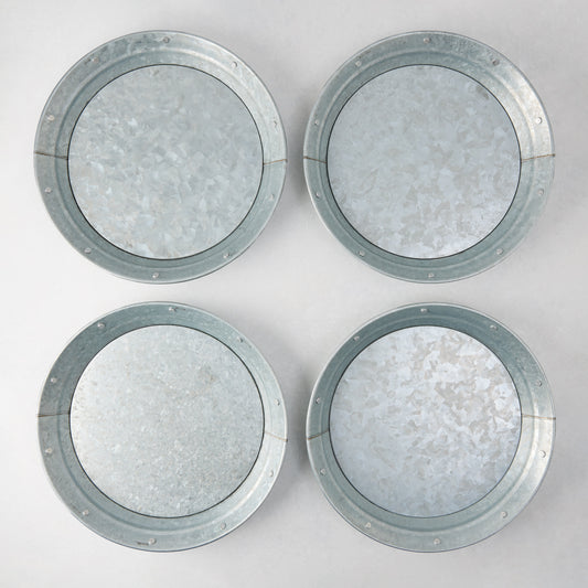 Set of 4 round galvanized metal plates with riveted edges, 12.75" diameter.