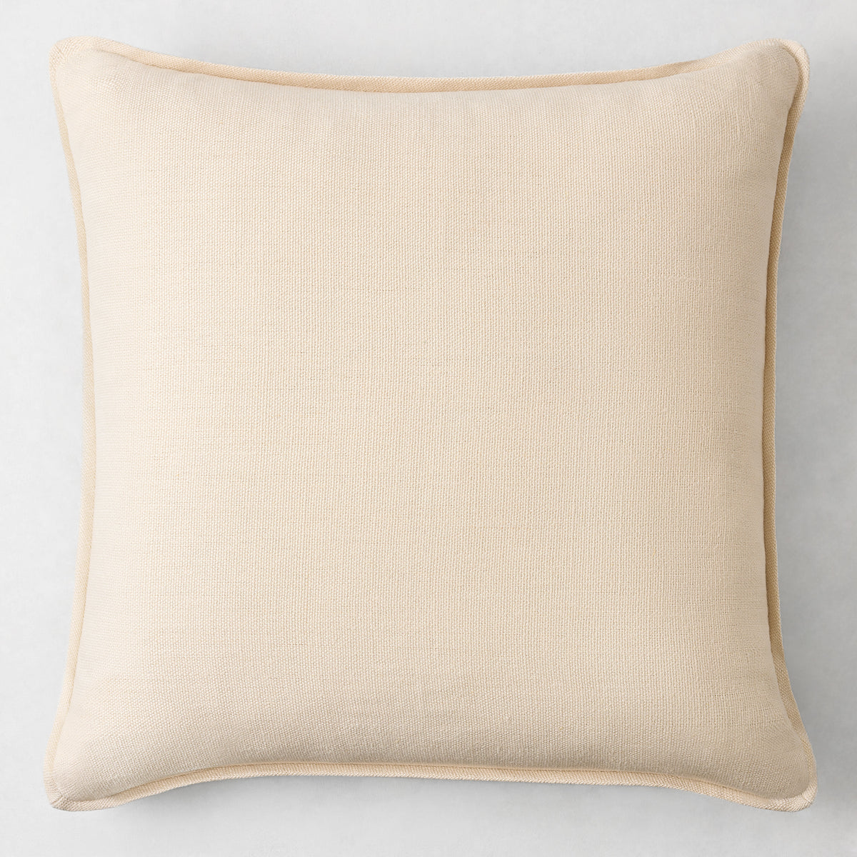22-inch square beige Belgian linen pillow with a decorative flange border and hidden zipper closure.