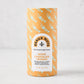 Geaux Nuts White Chocolate Crunch in an orange tube with light blue trumpet pattern and white label.