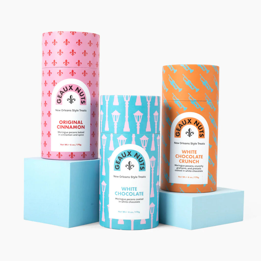Blue Geaux Nuts White Chocolate Pecans tube with pink streetlamp pattern.