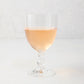 Georgia Eco-Crystal Stemmed Wine Glass, 12oz, with ribbed clear glass and rose wine.