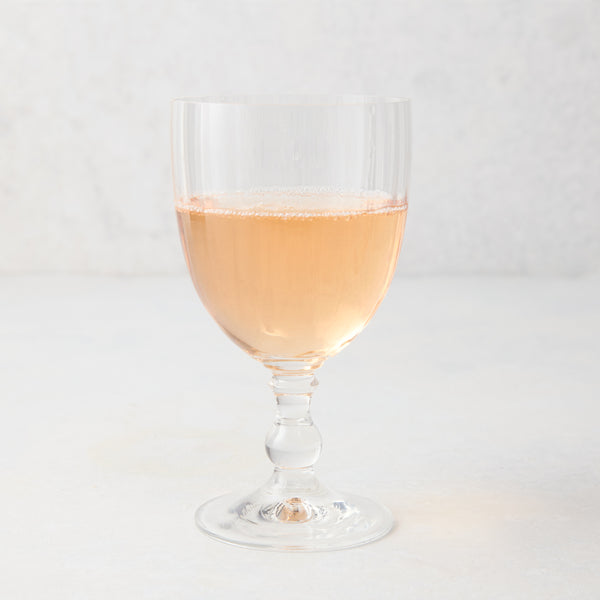 Georgia Eco-Crystal Stemmed Wine Glass, 12oz, with ribbed clear glass and rose wine.