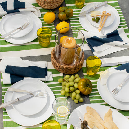 Gio Ponti Stainless Steel 5-piece flatware set on a striped green and white table setting.