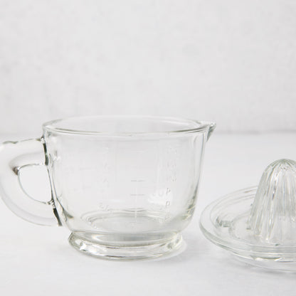 Clear recycled glass juicer/pitcher with handle, spout, engraved measurements, and separate reamer lid.