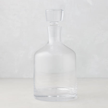 Clear mouth-blown glass wine and whiskey decanter with broad base and curved neck, 10.25"H.