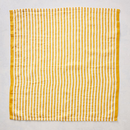 21-inch square linen napkin with golden yellow ticking stripes on a white base and a solid yellow border.
