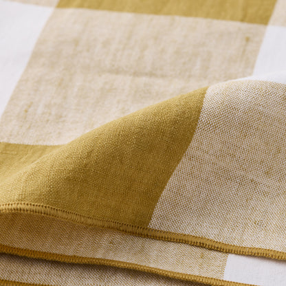 Goldenrod Buffalo Check Linen Napkin, 20"x20", folded, showing gold yellow and white squares.