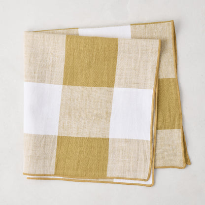Goldenrod Buffalo Check Linen Napkin, 20" x 20", folded, with gold yellow and white squares.