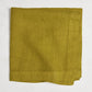 Goldenrod HG Signature hand-dyed linen napkin, 22-inch square, folded, with mitered corners.