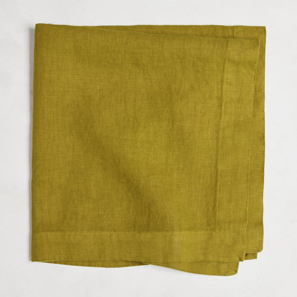 Goldenrod HG Signature hand-dyed linen napkin, 22-inch square, folded, with mitered corners.