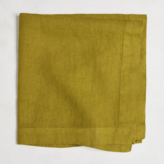 Goldenrod HG Signature hand-dyed linen napkin, 22-inch square, folded, with mitered corners.