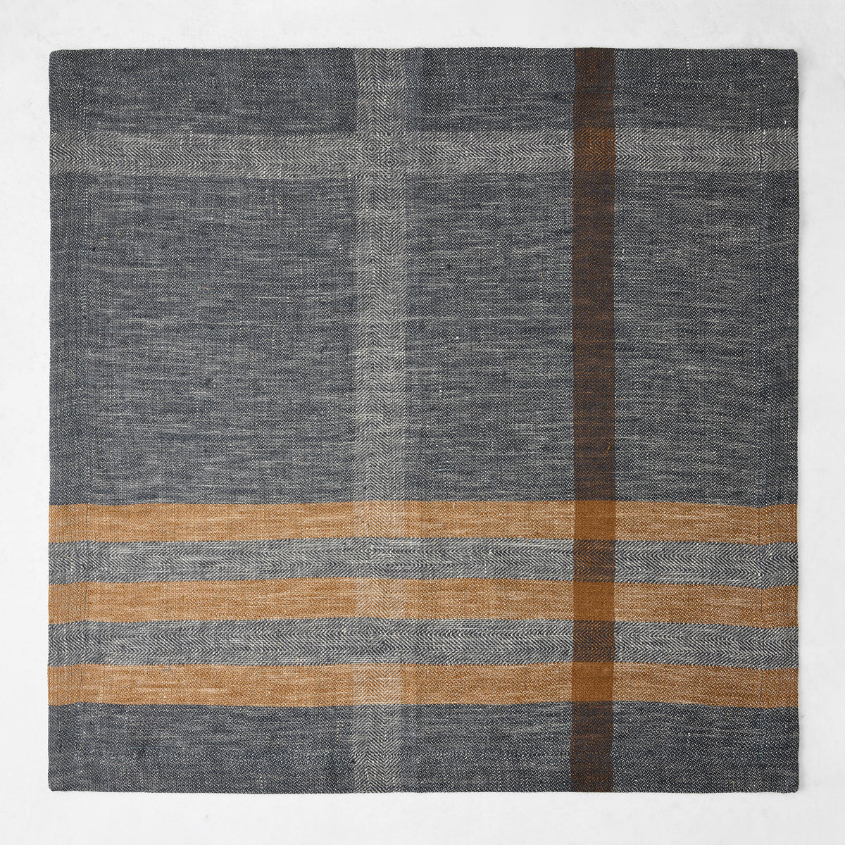 21-inch square linen napkin in graphite gray and camel brown with a herringbone weave and modern plaid pattern.
