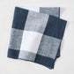 Graphite Blue Buffalo Check Napkin, 20" square, linen-cotton blend, folded.