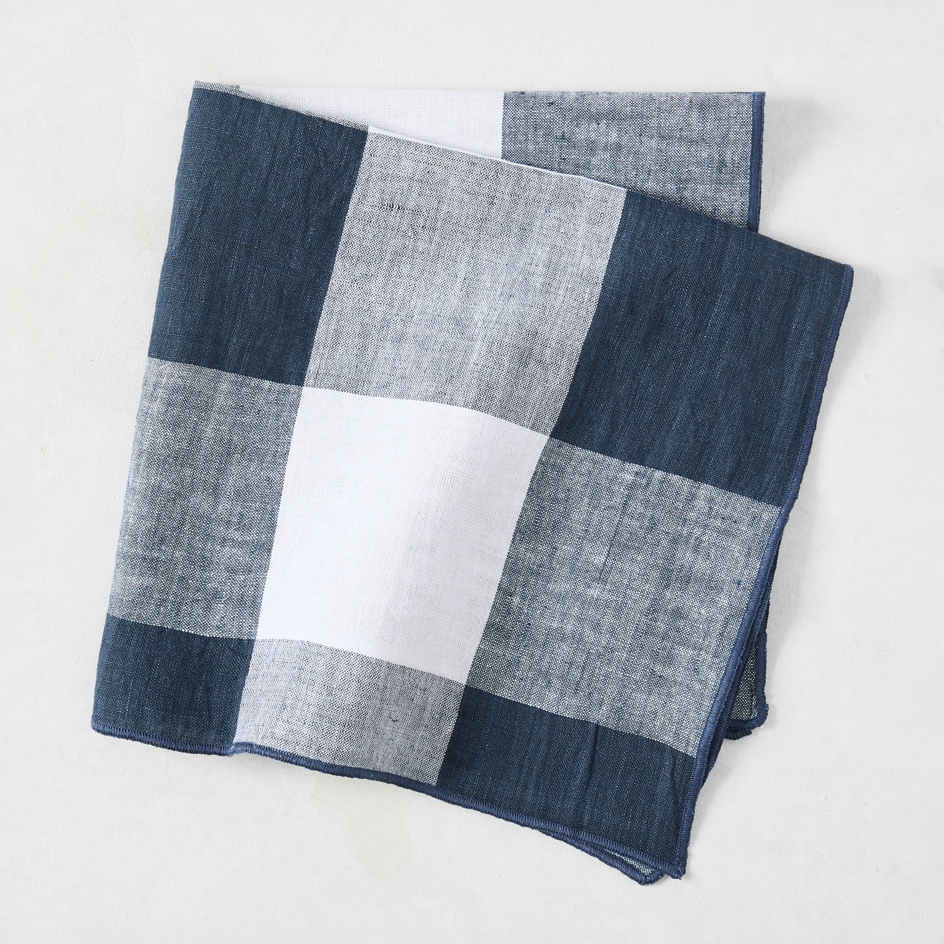 Graphite Blue Buffalo Check Napkin, 20" square, linen-cotton blend, folded.