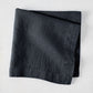 Graphite HG Signature hand-dyed 22-inch square linen napkin, folded.